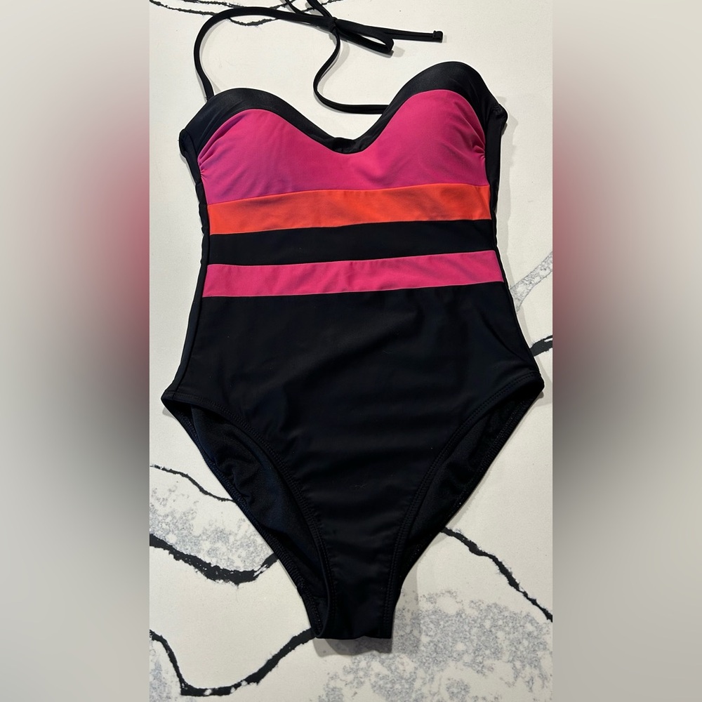 Sandflower one piece bathing in pink, orange and black.